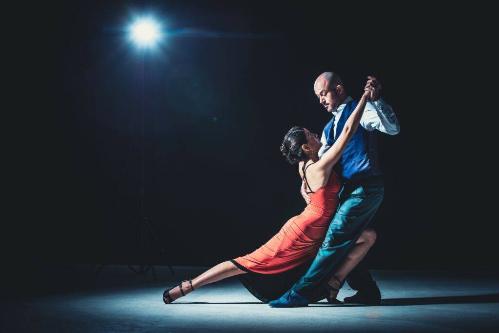 Couple dancing Salsa with spotlight in Cali
